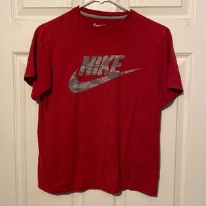 Boys Nike T-shirt size large there’s a couple spots on the shirt